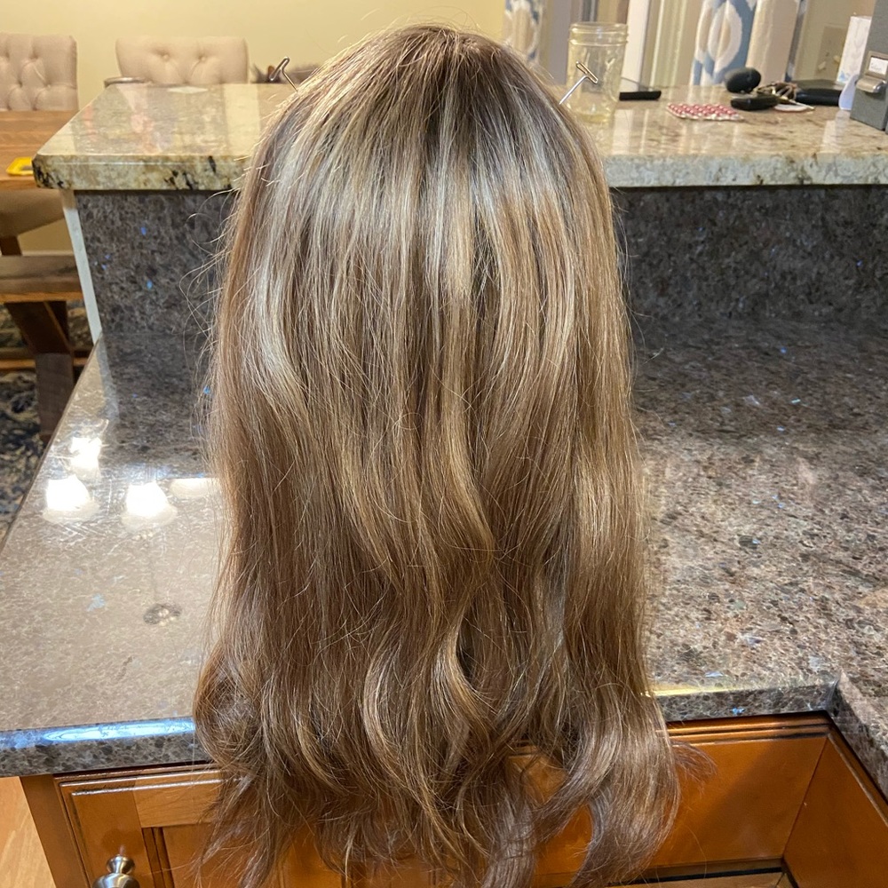 16in Permafrost real hair mono topper. Beautiful color w/ money piece highlights